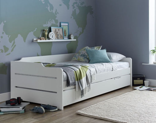 Another view of the white guest single bed with trundle.
