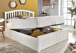 White wooden ottoman bed with storage.