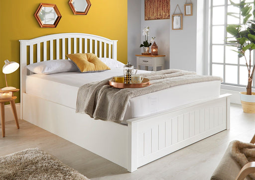 Another perspective of the white ottoman bed.