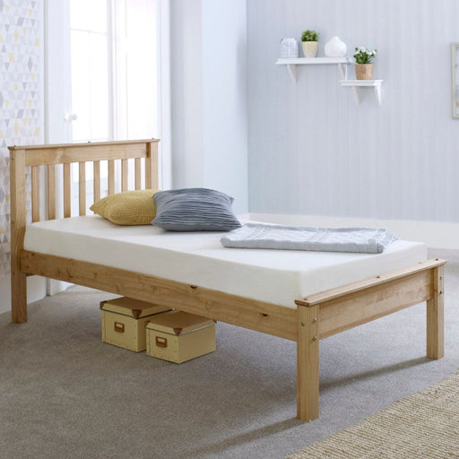 Wax pine wooden single bed with a rustic charm.