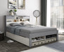 Grey and white wooden guest bed.