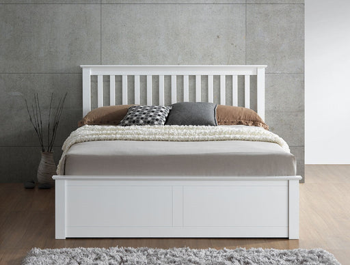 White wooden ottoman bed with storage.
